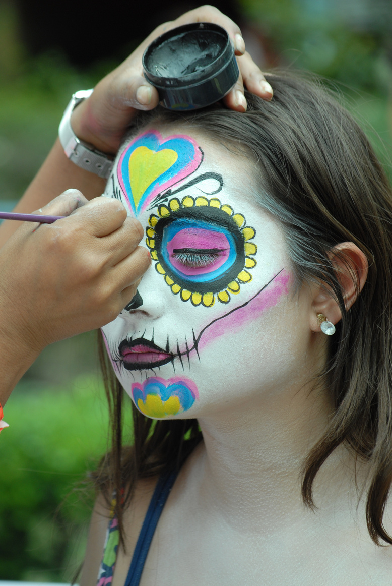 A Woman Having Her Face Painted